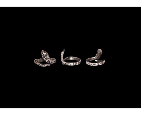 17th century AD. A silver finger ring formed as a serpent with head raised, skull to the rear of the head and flowers to the 