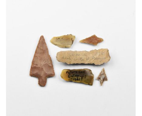 Neolithic, 6th-2nd millennium BC. A mixed group comprising two small and one large barbed and tanged flint arrowheads and thr