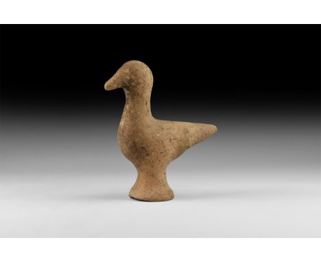 2nd millennium BC. A ceramic figure of a bird with stylised features, standing on a conical base.   194 grams, 12cm (4 3/4").