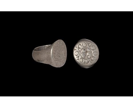 14th-15th century AD. A silver finger ring comprising a D-section hoop and discoid bezel with intaglio spread eagle in disc w