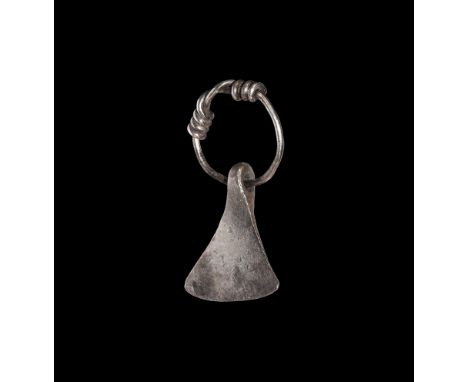 9th-12th century AD. A silver pendant of a miniature Mammen type axe, with wide blade and pierced to the top; suspension ring