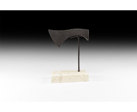 5th-8th century AD. An iron axehead, or francisca, for throwing with square rear edge, scooped upper face and curved edge; mo