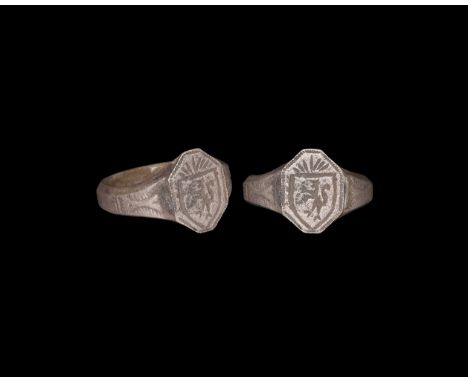 15th-16th century AD. A silver finger ring comprising a tapering hoop with chamfered edges, octagonal bezel with low-relief h