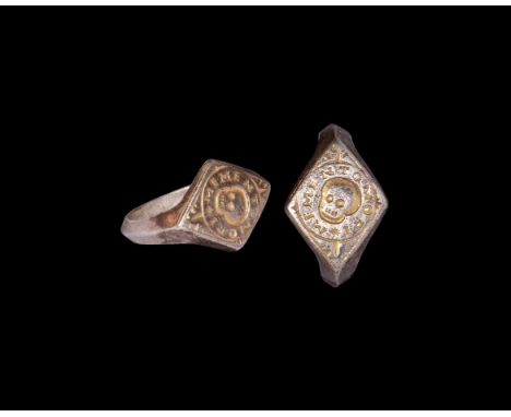 17th century AD. A silver parcel-gilt ring with keeled hoop, lozengiform bezel with central skull motif and 'MEMENTO MORI' le
