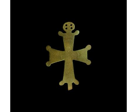 11th-12th century AD. A bronze processional cross with pierced disc above, lobe to each angle with beast-head detailing, low-