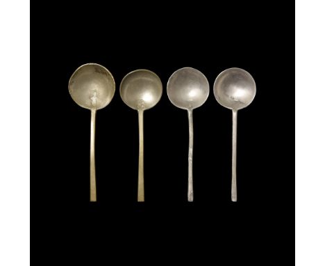 17th-18th century AD. A group of pewter spoons, each a broad shallow bowl with chamfered rim, trapezoidal-section handle, sta