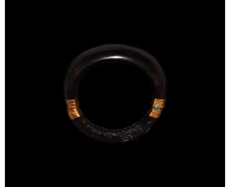 4th-2nd century BC. A D-section bone bracelet with ribbed gold hinge and fastener.   32 grams, 66mm (1 1/4"). From the collec