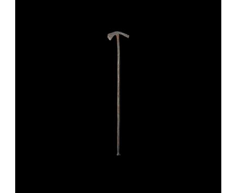 1st-2nd century AD. An iron miniature hammer with round-section shaft developing to the square-section head, to one side a ro