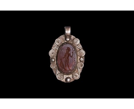 18th-19th century AD. A carnelian cloison with intaglio standing nude hoplite with crested helmet, spear and large domed shie