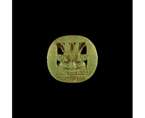 Late Period, 664-332 BC. A glazed composition openwork plaque with the bust of Bes, facing forward, wearing plumed headdress;