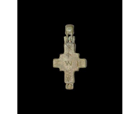 10th-12th century AD. A bronze reliquary cross pendant with hinged loop, inscription to each face: 'ZWE' '*?WW*' and '??????'