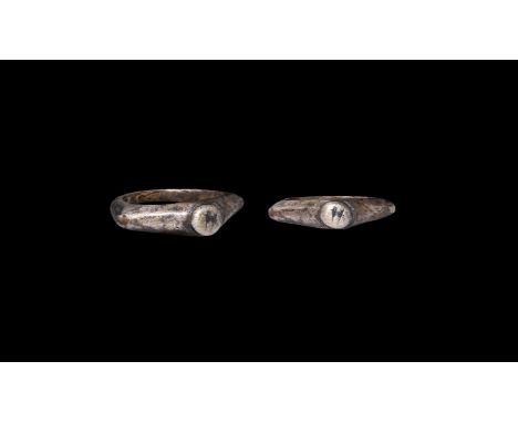 3rd century AD. A silver finger ring with keeled shoulders, discoid plaque with incised 'H' motif. Cf. Ruseva-Slokoska, L. Ro