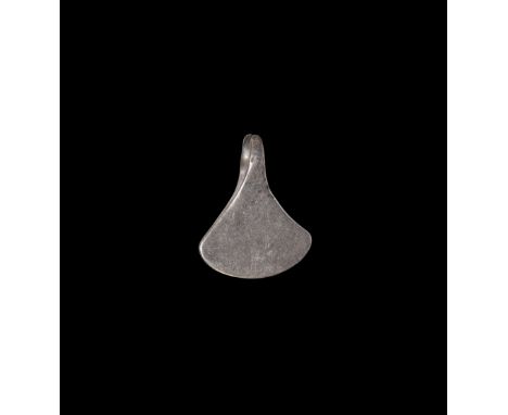 9th-12th century AD. A silver pendant of a miniature Mammen type axe, with wide blade and pierced to the top.   3.01 grams, 2