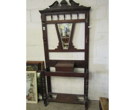 EARLY 20TH CENTURY WALNUT MIRRORED BACK COAT STAND WITH CENTRAL GLOVE BOX FLANKED EITHER SIDE BY STICK STAND ON TURNED SUPPOR