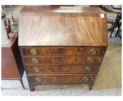 EARLY 19TH CENTURY MAHOGANY BUREAU, FALL FRONT ENCLOSING A FITTED INTERIOR, FOUR GRADUATED FULL WIDTH DRAWERS BELOW ON BRACKE