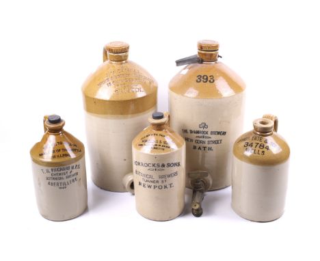 A group of five assorted stoneware storage flagons. Including ones marked Bristol, Bath and Wells, etc. Max. H43cm   Conditio