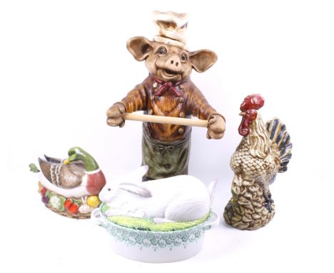 Four kitchen animal figures including a pig, duck, etc. A resin pig kitchen roll holder, two covered dishes moddelled as a ra