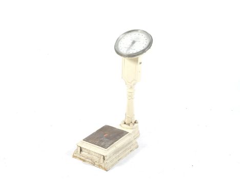 A vintage Salters 'Compact' weighing machine scales. To weigh 20 stone by 1lb. With painted cast iron base. H80cm