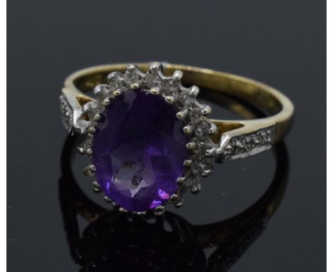 9ct gold amethyst and diamond surround dress ring, 2.6 grams, size M.  