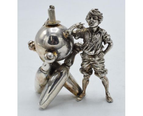 Novelty silver plated table lighter in the form of a boy with bowling equipment, 9.5cm tall. No lighting component.