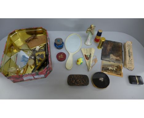 Assorted items including a fan, a compact, etc. 
