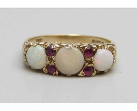 A 9ct gold, opal and ruby set ring, 3.5g, O, centre stone cracked 