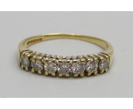 An 18ct gold, seven stone diamond ring, 2.1g, N 