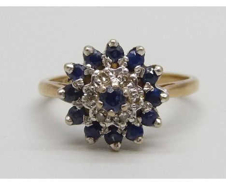 An 18ct gold, sapphire and diamond cluster ring, 4.34g, M 