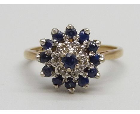 An 18ct gold, sapphire and diamond cluster ring, 4.34g, M 