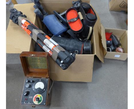 A collection of cameras and camera equipment including tripods, lenses and a moisture indicator **PLEASE NOTE THIS LOT IS NOT