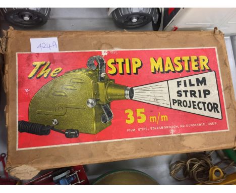 A VINTAGE 'THE STIP MASTER' 35MM FILM STRIP PROJECTOR 