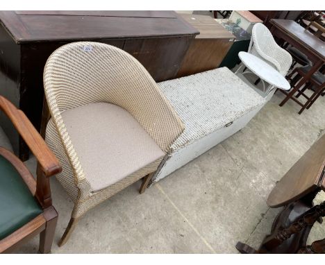 A LLOYD LOOM CHAIR AND OTTOMAN, A LLOYD LOOM STYLE COMMODE AND A WHITE PAINTED TABLE/MAGAZINE RACK 