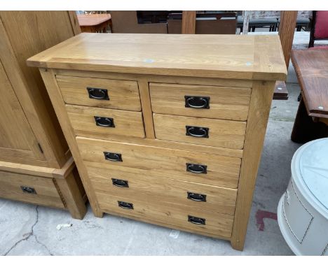 A LIGHT OAK CHEST OF FOUR SHORT AND THREE LONG DRAWERS, 39" WIDE 