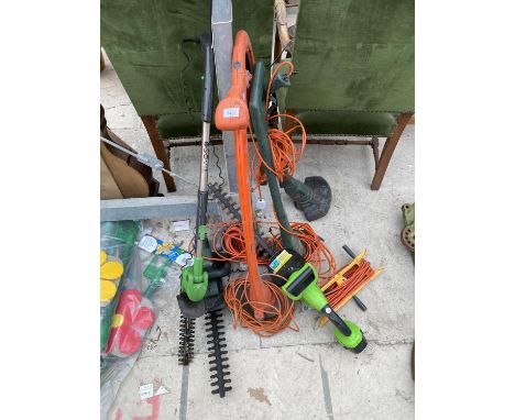 AN ASSORTMENT OF ELECTRIC GARDEN TOOLS TO INCLUDE STRIMMERS AND HEDGE CUTTERS ETC 