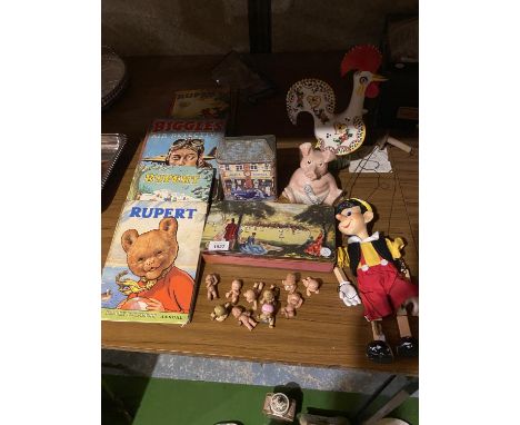 SIX VINTAGE ANNUALS, A PINNOCHIO STRING PUPPET. A COLLECTION OF SMALL BABY DOLLS ETC 