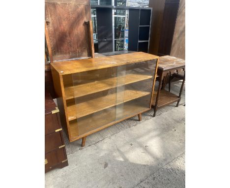 A LIGHT OAK BOOKCASE 