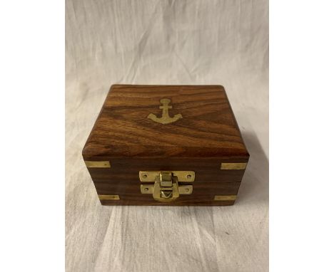 A SMALL BOXED BRASS BOY SCOUT COMPASS 
