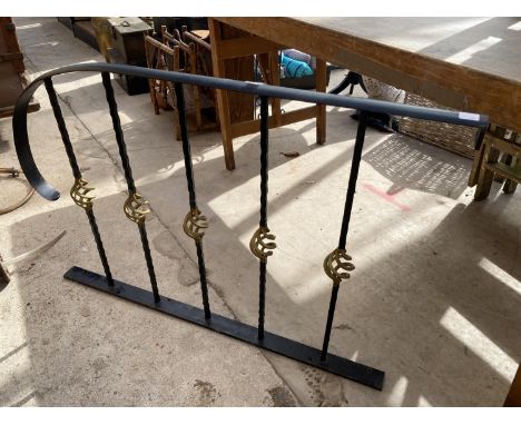 A DECORATIVE WROUGHT IRON RAILING 