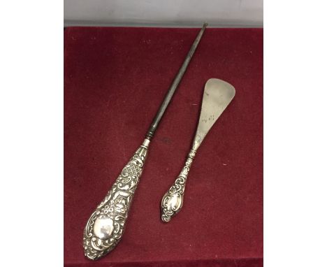 TWO HALLMARKED CHESTER SILVER HANDLED ITEMS 1902/3 AND 1900/01 TO INCLUDE A BUTTON HOOK (A/F) AND A SHOE HORN 
