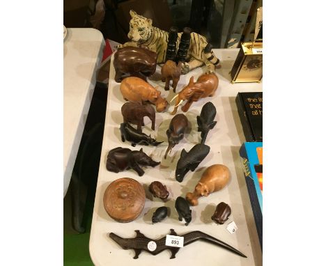 A QUANTITY OF TREEN ITEMS IN THE FORM OF SAFARI ANIMALS TO INCLUDE SEVERAL ELEPHANT FIGURES AND A CERAMIC TIGER 