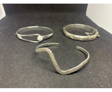 THREE MARKED SILVER BANGLE STYLE BRACELETS 
