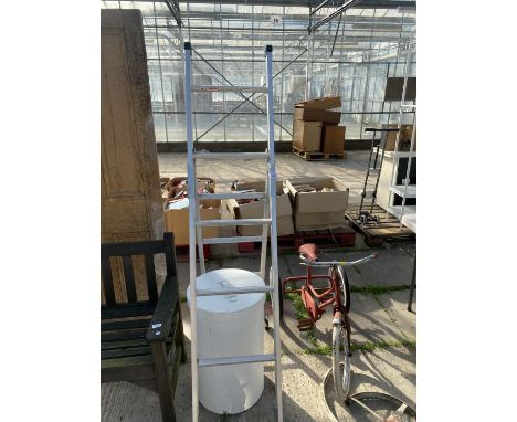 AN ALUMINIUM STEP LADDER AND A LAUNDRY BASKET 