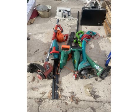 AN ASSORTMENT OF ELECTRIC GARDEN TOOLS TO INCLUDE THREE HEDGE CUTTERS AND THREE GRASS STRIMMERS 