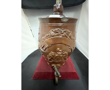 A VINTAGE GLAZED STONEWARE EMBOSSED FLAGON WITH BRASS TAP A/F 
