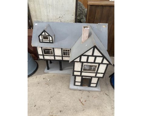 A LARGE VINTAGE WOODEN DOLLS HOUSE 