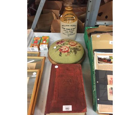 A VINTAGE WILLIAM HURDUD' STONEWARE BOTTLE, A VINTAGE LOW EMBROIDERED FOOTSTOOL AND A HARD BACK TWELFTH EDITION OF THE DIRECT