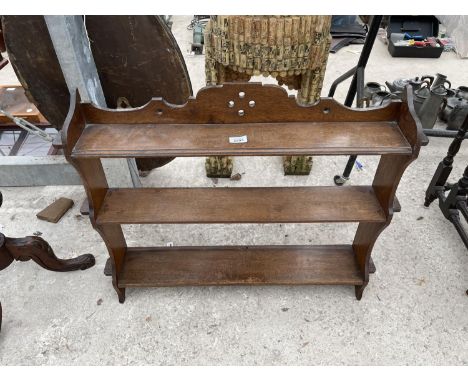 A VICTORIAN OAK THREE TIER WALL SHELF, 32" WIDE 