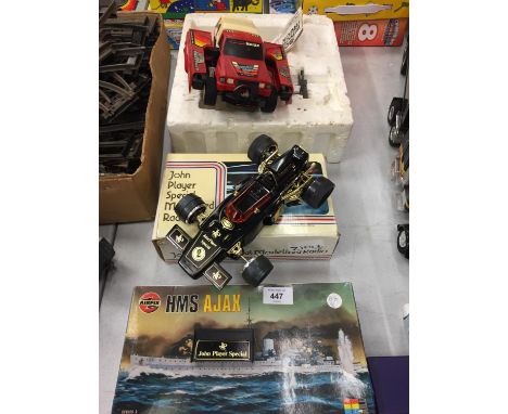 A HMS AJAX AIRFIX KIT, A RADIO IN THE FORM OF A JPS AND A ROBOT WINCH TRUCK TRANSFORMER 