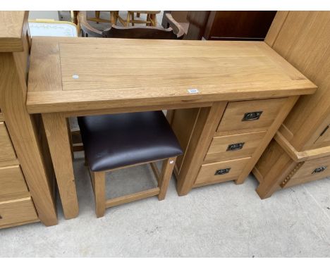 A LIGHT OAK DRESSING TABLE WITH THREE DRAWERS, TOGETHER WITH A STOOL, 45" WIDE 