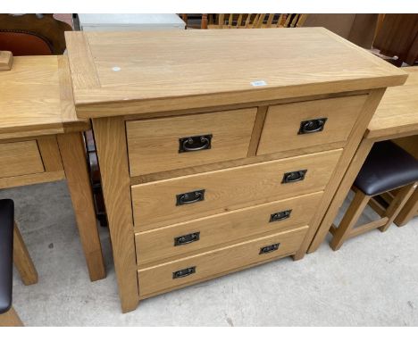 A LIGHT OAK CHEST OF TWO SHORT AND THREE LONG DRAWERS, 37.5" WIDE 